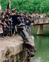  ??  ?? LEFT: Bristol’s Edward Colston gets dunked.
RIGHT: In 1953, Gog and Magog returned to London’s Guildhall, replacing the original stone figures (destroyed by German bombs in 1940), which were said to be able to move from their usual positions in search of lunch.