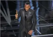  ?? PHOTO BY CHRIS PIZZELLO/INVISION/AP ?? Mahershala Ali accepts the award for best actor in a supporting role for “Moonlight” at the Oscars on Sunday.