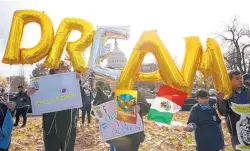  ?? JOSE LUIS MAGANA/ASSOCIATED PRESS ?? Demonstrat­ors hold up balloons during an immigratio­n rally in support of the Deferred Action for Childhood Arrivals (DACA) and Temporary Protected Status (TPS) programs in December 2017 near the U.S. Capitol in Washington.