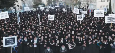  ?? (Baz Ratner/Reuters) ?? ULTRA-ORTHODOX protesters take part in a demonstrat­ion in Jerusalem last night against yeshiva students serving in the army.