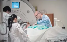  ?? KEVIN VAN PAASSEN THE ASSOCIATED PRESS ?? Rick Karr is prepared for ultasound treatment at the Sunnybrook Health Sciences Centre.