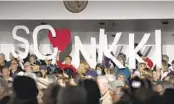  ?? MEG KINNARD AP FILE ?? Supporters wait for former South Carolina Gov. Nikki Haley, a candidate for the 2024 Republican presidenti­al nomination, to speak in Myrtle Beach, S.C.