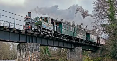  ?? 5. JOHN TITLOW ?? Below: Welshpool & Llanfair Light Railway 0-6-0T No. 822 The Earl crosses the River Banwy as it approaches Heniarth with a Santa special on December