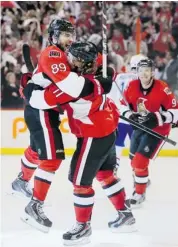  ?? Wayne Cuddington /Postmedia News ?? wCory Conacher, left, celebrates his last-minute third period goal with Daniel Alfredsson, forcing overtime. The Sens scored early in OT to take a 3-1 series lead.
