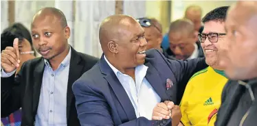  ?? Pictures: EUGENE COETZEE ?? THE WINNERS: Andile Lungisa, left, mayor Mongameli Bobani and Lawrence Troon celebrate their court victory for control of the city council