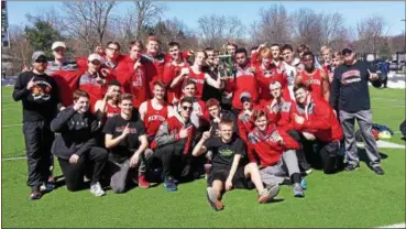  ?? CHRIS LILLSTRUNG — THE NEWS-HERALD ?? The Mentor boys celebrate their boys team title win April 8 at the Nordonia Knight Relays.