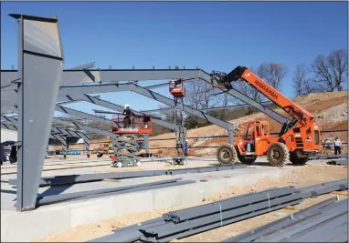  ?? (NWA Democrat-Gazette/David Gottschalk) ?? Constructi­on work continues Tuesday on the expansion of Wilson Combat in Berryville. The company is adding 16,000 square feet to bring in more machinery to help build parts for pistols, rifles, shotguns and accessorie­s. Check out nwaonline.com/201213Dail­y/ and nwadg.com/photos for a photo gallery.