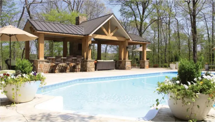  ??  ?? Taylor King recently added a pavilion to his home’s pool area.The pavilion has several seating options, a gas-start fireplace and a gas grill.