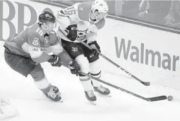  ?? LYNNE SLADKY/AP ?? Mike Matheson (19) of the Panthers and the Stars’ Jason Dickinson (16) battle for the puck. Florida has won two out of their last three before heading on the road for a west coast swing.