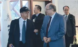  ??  ?? PROF. TONY CHAN, president of the Hong Kong University of Science and Technology (left), shares words with Technion-Israel Institute of Technology president Prof. Peretz Lavie in Haifa yesterday.