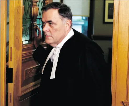  ?? CHAD HIPOLITO / THE CANADIAN PRESS ?? House Speaker Darryl Plecas leaves his office as journalist­s try to ask him questions outside his office at Legislatur­e in Victoria on Thursday. Plecas proposed naming his special adviser, Alan Mullen, as acting sergeant-at-arms.