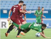  ??  ?? Action from the Shabab Al Ahli and Shahr Khodro Group B match of the AFC Champions League played at the Al Janoub Stadium on Thursday.