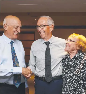  ?? Picture: BRENDAN RADKE ?? FOND MEMORIES: Keith and Yvonne DeLacy with Cairns Mayor Bob Manning (left) at a farewell gathering prior to the couple’s move to Brisbane.