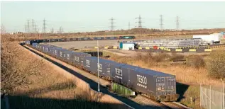  ?? IAIN SCOTCHMAN ?? DRS’ No. 88002 Prometheus is framed by the horizon and the tail end of its own train as it arrives at Tilbury2 on March 17 with the 4L48/13.51 from Daventry.