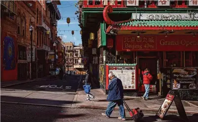  ?? Photos by Carlos Avila Gonzalez/The Chronicle ?? Business owners in San Francisco’s Chinatown are increasing­ly adopting cashless payment methods. A pilot program has rolled out tablets and card readers to six businesses there.