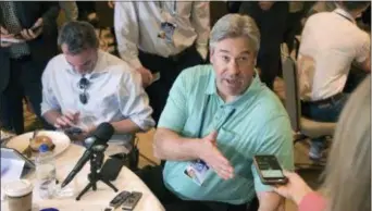  ?? PHELAN M. EBENHACK — AP IMAGES FOR NFL ?? Eagles head coach Doug Pederson, center, answers a question from a reporter coaches breakfast during the owners meetings on Tuesday in Orlando, Fla. at the