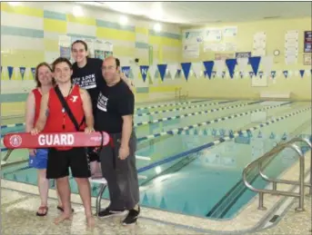  ?? MICHILEA PATTERSON — FOR DIGITAL FIRST MEDIA ?? Pottstown YMCA staff pose for a photo in front of the indoor pool which recently got a new filtration and pump system to make sure the water stays clean and safe. The updates is one of many that the Pottstown branch has recently undergone.