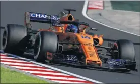  ??  ?? CONFORME. Fernando Alonso fue octavo en el GP de Hungría.
