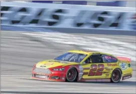  ?? ISAAC BREKKEN / ASSOCIATED PRESS ?? Joey Logano, after a track-record qualifying lap of 193.278 mph Friday, will start on the pole for today’s race at Las Vegas Motor Speedway.