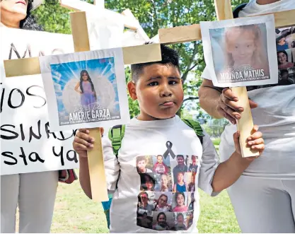  ?? ?? Protesters outside an NRA meeting in Houston, Texas, above. Left, Donald Trump speaking to the National Rifle Associatio­n