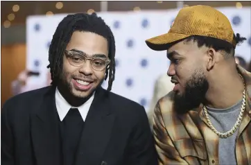  ?? JIM MONE — THE ASSOCIATED PRESS ?? D’Angelo Russell, left, was traded Thursday from the Warriors to the Minnesota Timberwolv­es, where he’ll team with Karl-Anthony Towns, right. The deal will help the Warriors escape the expensive luxury tax.