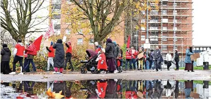  ?? PAUL GILLIS ?? Residents of Bristol’s tower blocks gather for a vigil and march at Twinnell House