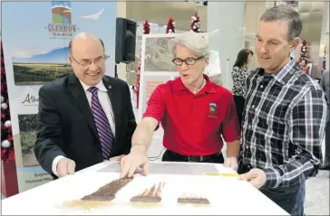  ?? Lorraine Hjalte/calgary Herald ?? Shell’s Louis Auger, left, Glenbow Ranch Provincial Park Foundation CEO Andy Crooks and foundation chairman Tim Harvie help launch the Shell Foothills Fescue Research Institute at the park on Monday.