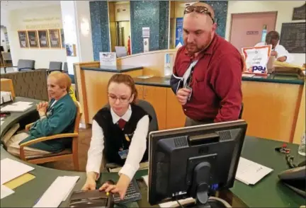  ?? DONNA ROVINS — DIGITAL FIRST MEDIA ?? Candace Harris, left, is one of two new Security Concierge Officers at Pottstown Memorial Medical Center. On Monday, the hospital will launch a new process requiring visitors to check-in and obtain a visitors’ badge before entering the hospital. Shown...