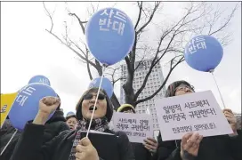  ?? LEE JIN-MAN / ASSOCIATED PRESS ?? Protesters in Seoul, South Korea, on Wednesday shout slogans during a rally opposing the deployment of the Terminal High Altitude Area Defense system, which is being installed after North Korean nuclear missile tests Monday.