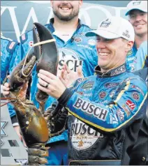  ??  ?? To the victor go the spoils, and in the case of Foxwoods Resort Casino 301 winner Kevin Harvick on Sunday the spoils included presentati­on of the ceremonial Loudon lobster in Victory Lane at New Hampshire Motor Speedway in Loudon, N.H.
