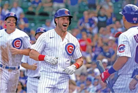  ?? NAM Y. HUH/AP ?? Third baseman Patrick Wisdom is all smiles after his go-ahead three-run homer in the fifth inning of Game 1 on Wednesday.