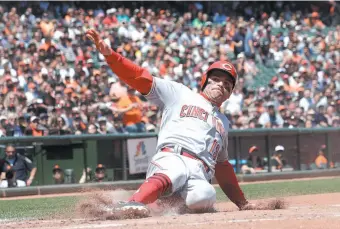  ?? AP PHOTO ?? Canadian Joey Votto of the Cincinnati Reds scores against the San Francisco Giants during a Wednesday game in San Francisco.