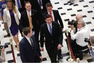  ??  ?? WASHINGTON: Speaker of the House Paul Ryan returns to his office after a successful vote on the passage of the American Health Care Act, the successor to the Affordable Care Act in Washington, DC. —AFP