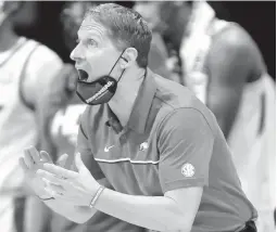  ?? GREGORY SHAMUS/GETTY ?? Arkansas coach Eric Musselman reacts on the sidelines during Sunday’s game against Texas Tech at Hinkle Fieldhouse in Indianapol­is, Indiana.