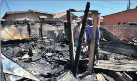  ??  ?? GUTTED: Shocked neighbours had tried in vain to help douse the deadly shack blaze.