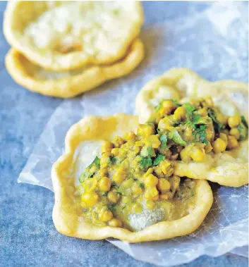  ?? PHOTOS: MATTHEW BENSON/THE EXPERIMENT ?? Vegan by nature, doubles are a popular street food in Trinidad and Tobago. Spicy chickpea stew is sandwiched between two fritters called bara. The dish is sometimes served with chutney.