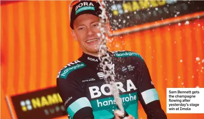  ??  ?? Sam Bennett gets the champagne flowing after yesterday’s stage win at Imola