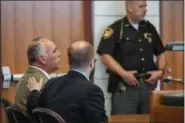  ?? ERIC BONZAR — THE MORNING JOURNAL ?? Thomas Fourdyce, 57, of Wellington, is consoled by his attorney Matthew Williams in Lorain County Common Pleas Judge Christophe­r Rothgery’s courtroom on June 6.