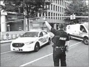  ?? BRENDAN SMIALOWSKI/GETTY-AFP ?? Police work Monday near the White House after a uniformed Secret Service officer shot a Maryland man.