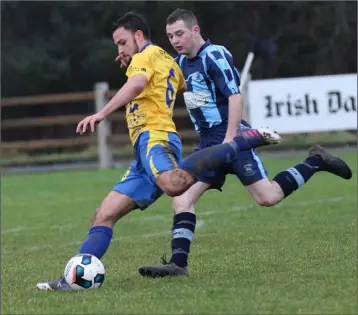  ??  ?? Robin Dempsey of North End United is tracked by Carl Somers of St. Mochta’s.