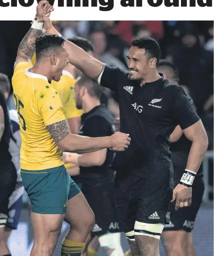  ?? Brett Phibbs ?? Wallabies fullback Israel Folau congratula­tes All Blacks loose forward Jerome Kaino after the final whistle.