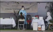  ?? DAMIAN DOVARGANES — THE ASSOCIATED PRESS ?? A nasal swab test is administer­ed at a same- day coronaviru­s testing site in Los Angeles on Tuesday.