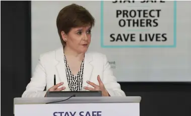  ??  ?? First Minister Nicola Sturgeon said she would ‘not hesitate’ to re-impose restrictio­ns if necessary