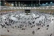  ??  ?? Muslim pilgrims circumambu­late around the Kaaba, Islam’s holiest shrine, at the Grand Mosque in the holy Saudi city of Makkah, a day before the annual pilgrimage. (AFP)