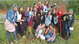  ?? (AFP) ?? Palestinia­n and Israeli Jewish girls pose for a photo at the ‘Creativity for Peace’ camp on July 30