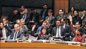  ?? AP PHOTO ?? From left, Olof Skoog, Sweden’s Ambassador to the United Nations, Karen Pierce, British Ambassador to the United Nations, Nikki Haley, United States Ambassador to the United Nations vote against a draft resolution presented by Russia during a Security...