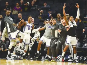  ?? TRIBUNE NEWS SERVICE ?? Sacramento bench players react after Kings guard Bogdan Bogdanovic made a jump shot to take an improbable lead in overtime against the Timberwolv­es at Target Center on Jan. 27.