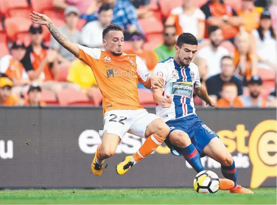  ?? Picture: AAP IMAGE ?? Brisbane recruit Eric Bautheac (left) could do little to stop Steven Ugarkovic and the Jets from claiming yesterday’s A-League match in Brisbane.