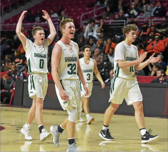  ?? PETE BANNAN — DIGITAL FIRST MEDIA ?? Bishop Shanahan’s Joe O’Malley (0), Tom Ford (32), Dan Dibeneditt­o (3) and Kevin Dodds (10) enjoy the last few seconds of their victory over Chester in the semifinal of the District 1 Class 5A tournament Wednesday at Temple University’s Liacouras Center.
