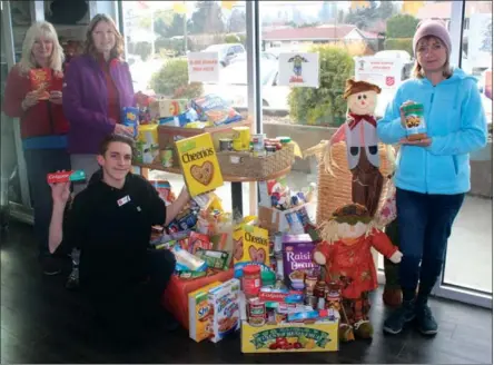  ?? Special to the Westside Weekly ?? Local businesses and residents showed their generosity last month as the Salvation Army held a Halloween food drive.